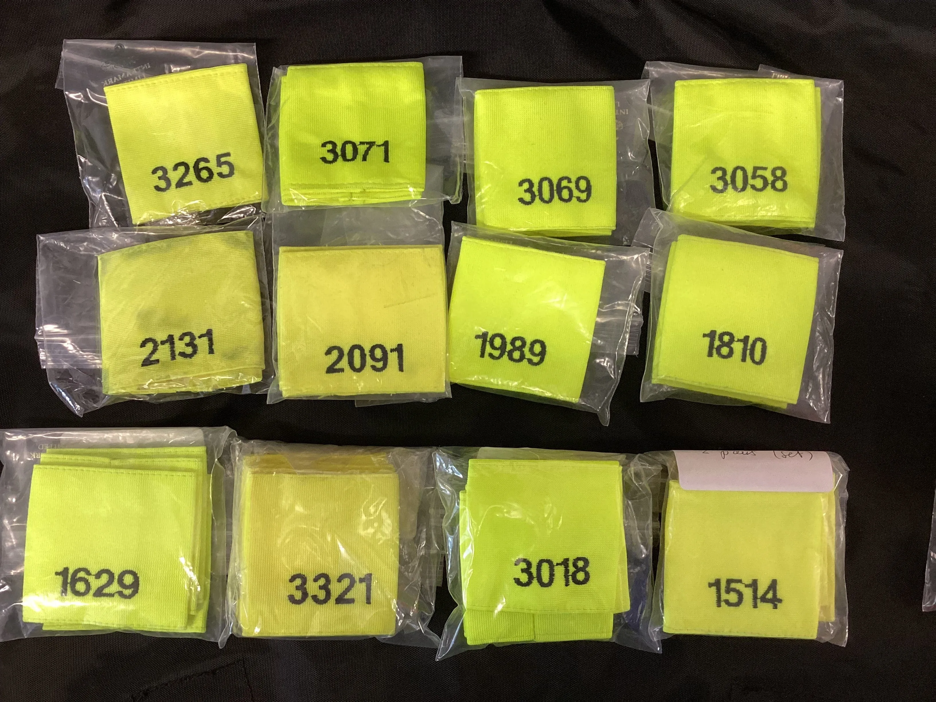 Epaulette Slides, Hi Vis yellow, black embroidered mixed numbers and lengths (Used – Grade A)